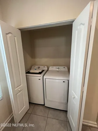 a utility room with dryer and washer
