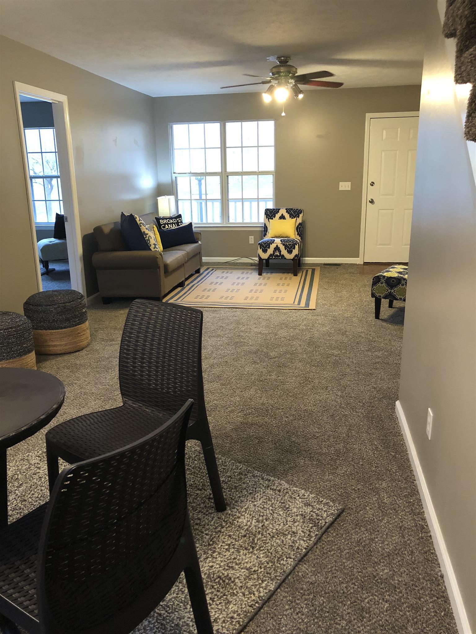 140 Gaskins Road Dickson, TN 37055 - Photo 14 of 27 a living room with furniture and a large window