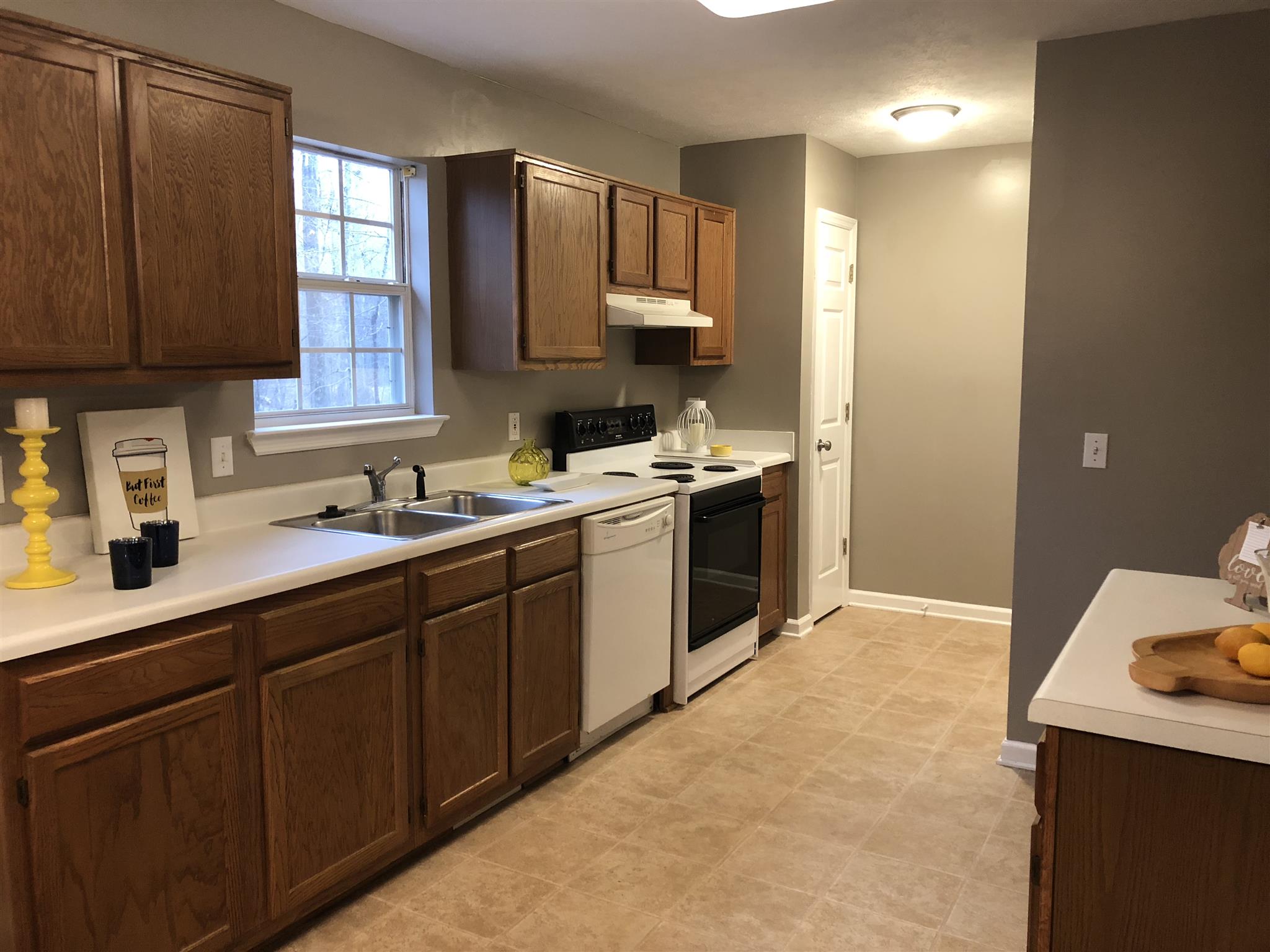 140 Gaskins Road Dickson, TN 37055 - Photo 15 of 27 a kitchen with a sink a stove and cabinets