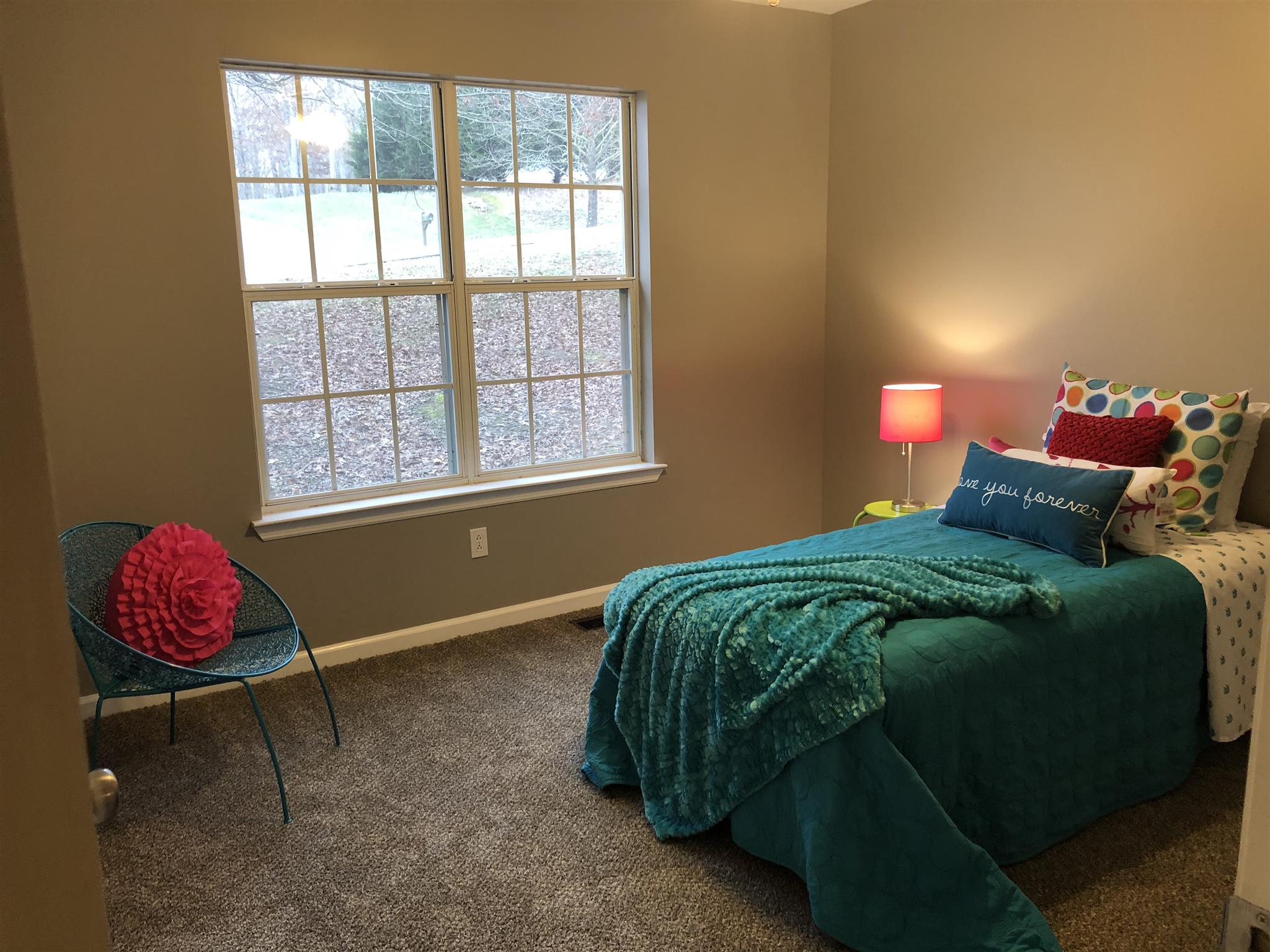 140 Gaskins Road Dickson, TN 37055 - Photo 19 of 27 a bedroom with a bed and window