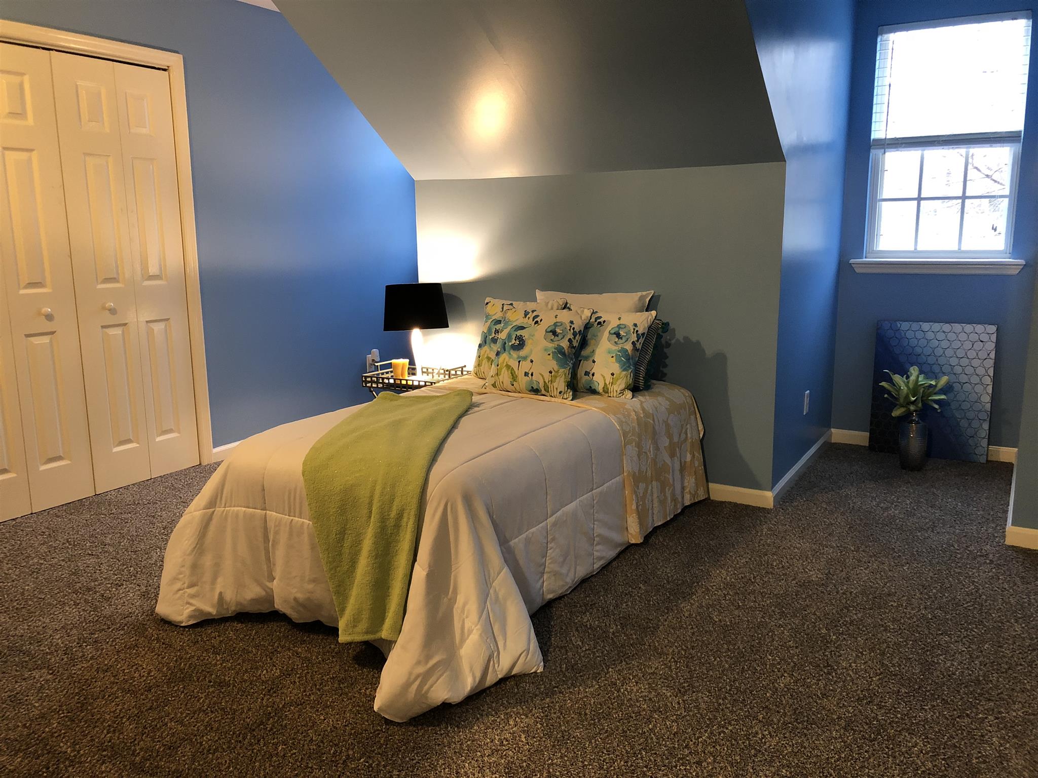 140 Gaskins Road Dickson, TN 37055 - Photo 23 of 27 a bed sitting in a bedroom next to a window