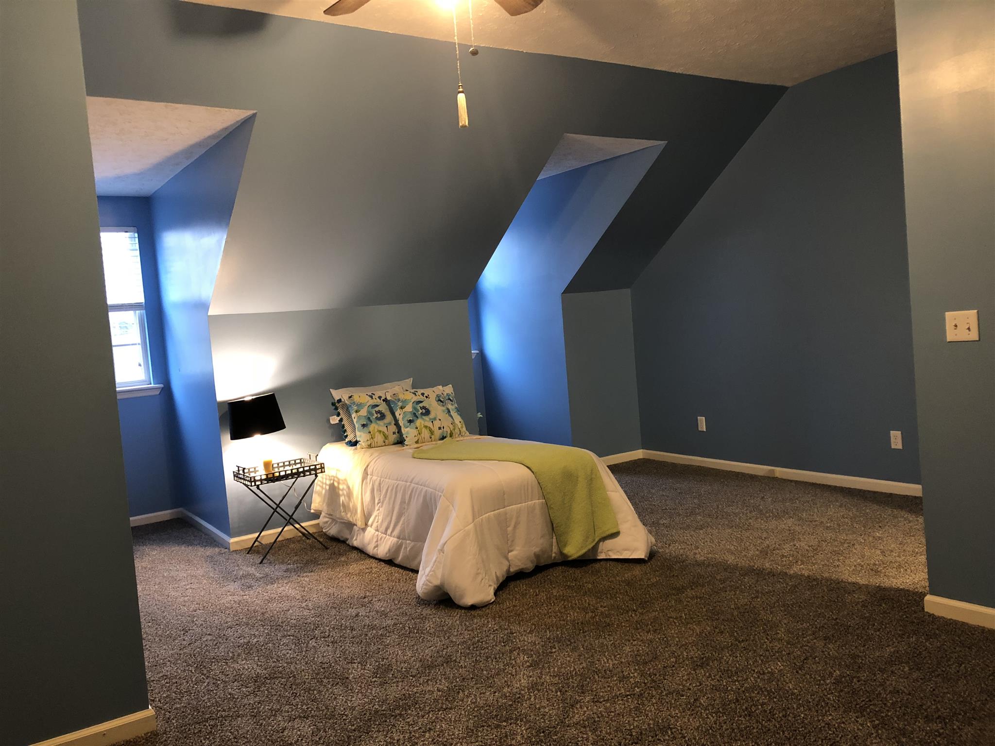 140 Gaskins Road Dickson, TN 37055 - Photo 26 of 27 a spacious bedroom with a bed and a table
