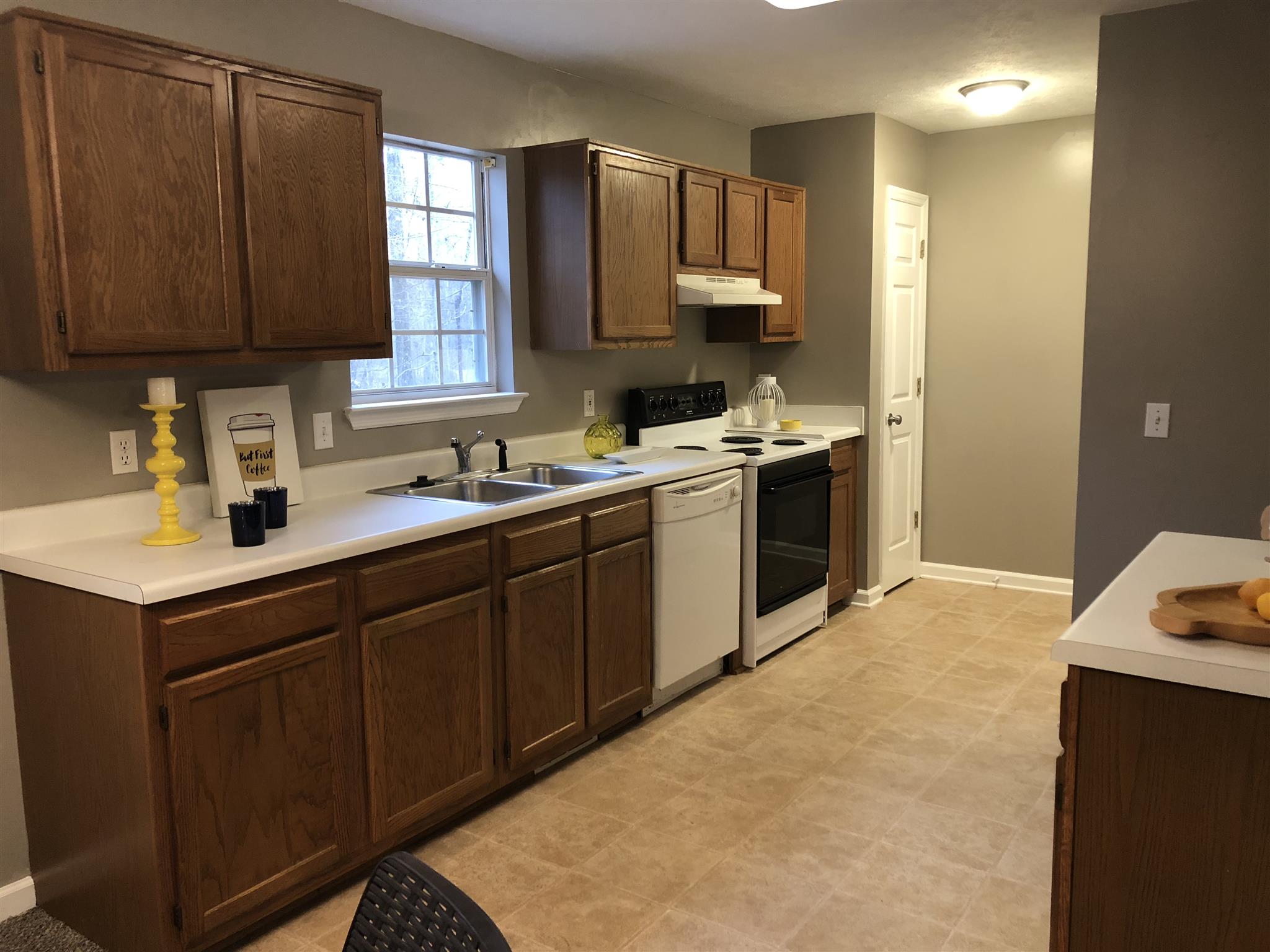 140 Gaskins Road Dickson, TN 37055 - Photo 9 of 27 a kitchen with a sink a stove and cabinets