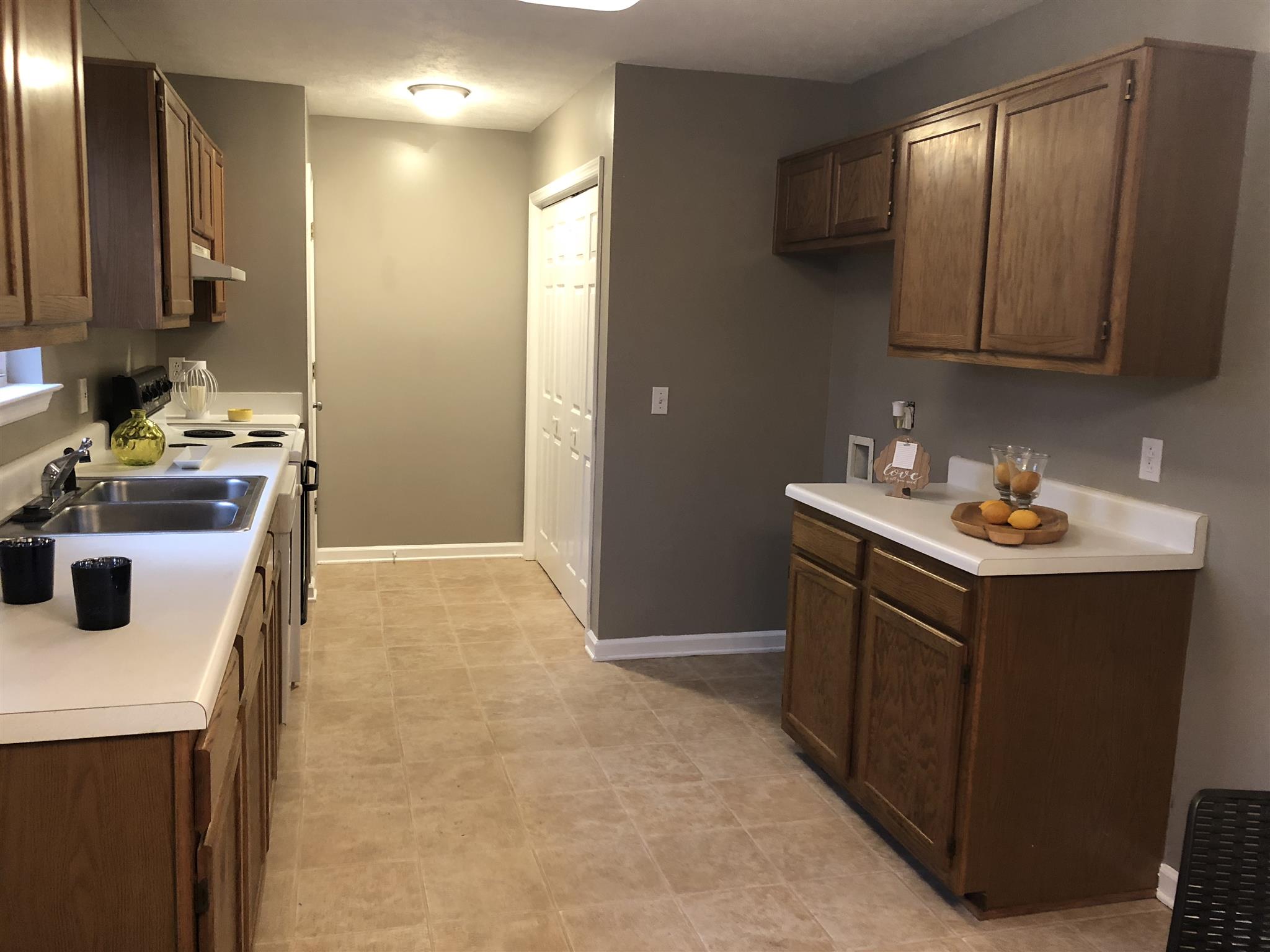 140 Gaskins Road Dickson, TN 37055 - Photo 10 of 27 a kitchen with a sink and cabinets