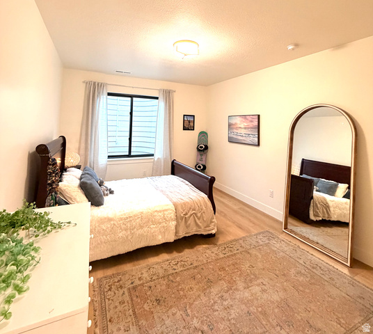 3626 Riverstone Road Mapleton, UT 84664 - Photo 42 of 58 Bedroom featuring baseboards and light wood-style floors