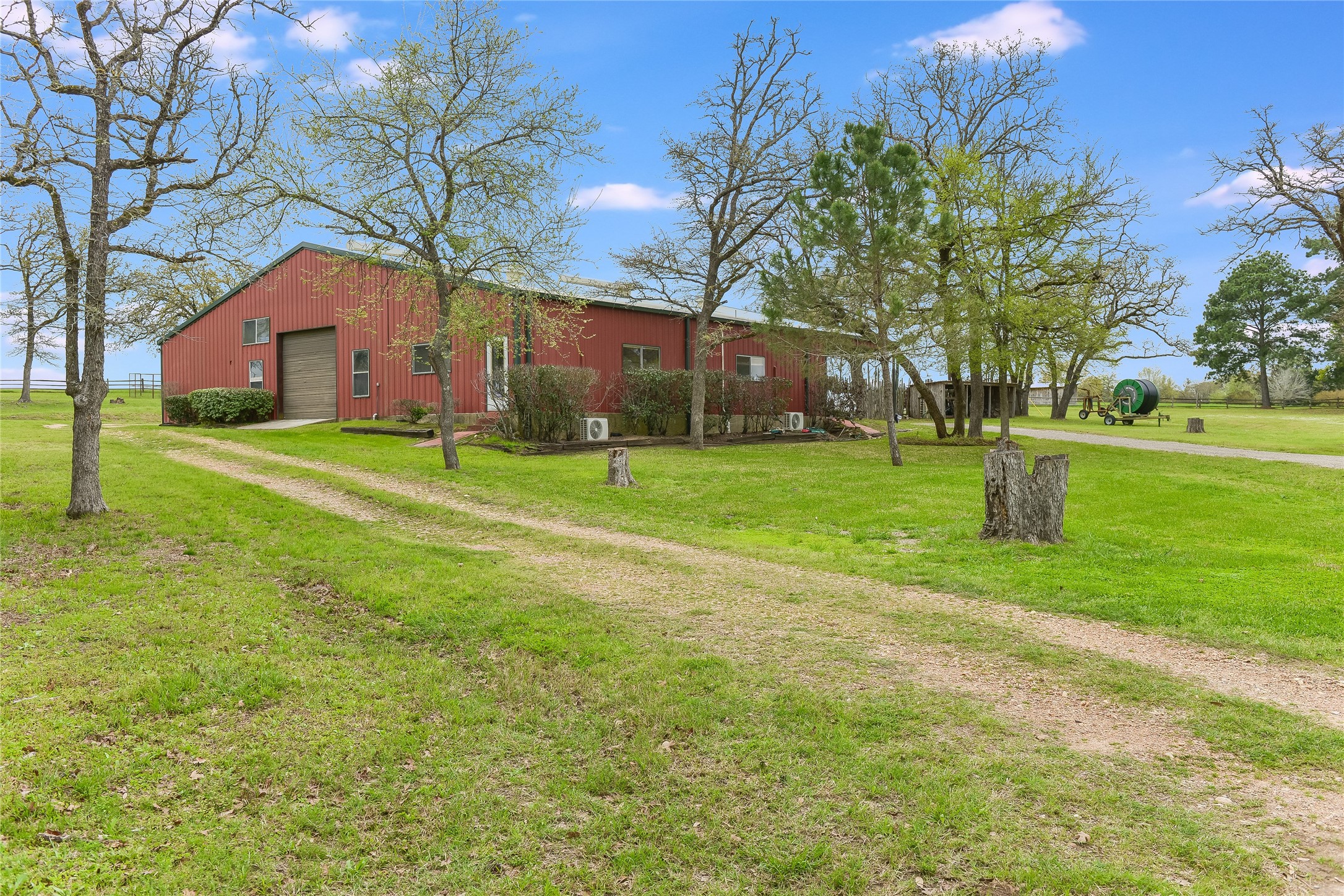 363 Paint Creek S Road, Unit A Paige, TX 78659 - Photo 14 of 28 Ranch Headquarters. 50'x25' interior - partially air conditioned w office, bathroom and man cave. 55' X 25' covered area for large equipment.