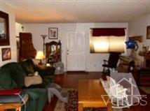 6525 Stoney View Lane, Unit 4 Simi Valley, CA 93063 - Photo 2 of 9 a living room with furniture and a flat screen tv