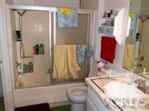 6525 Stoney View Lane, Unit 4 Simi Valley, CA 93063 - Photo 6 of 9 a bathroom with a granite countertop sink and a mirror