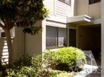6525 Stoney View Lane, Unit 4 Simi Valley, CA 93063 - Photo 7 of 9 a view of yellow house with a yard