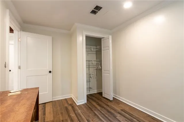 a view of room with window and wooden floor