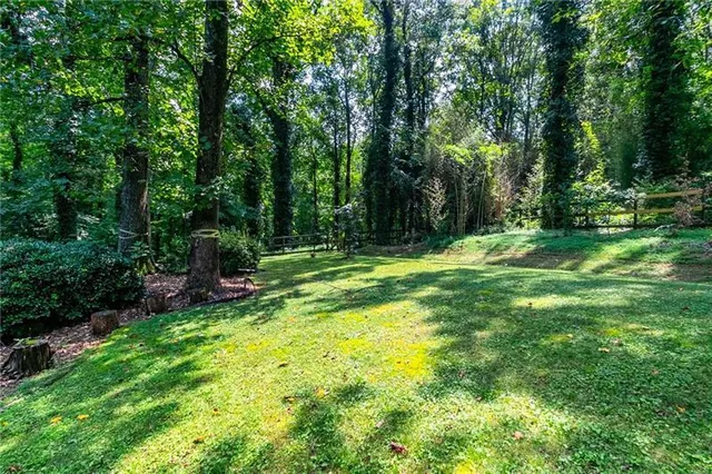a view of outdoor space with deck and yard