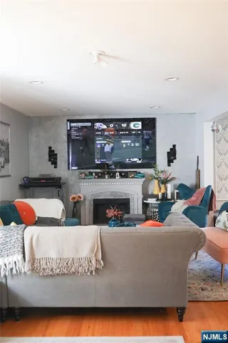 a living room with furniture and a fireplace