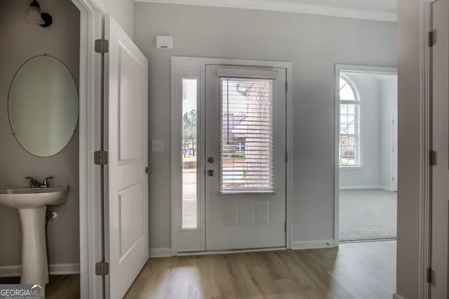 a view of a bathroom with a sink and a mirror