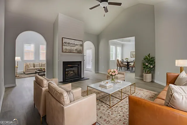 a living room with furniture and a fireplace