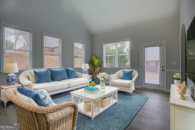 a living room with furniture and a large window