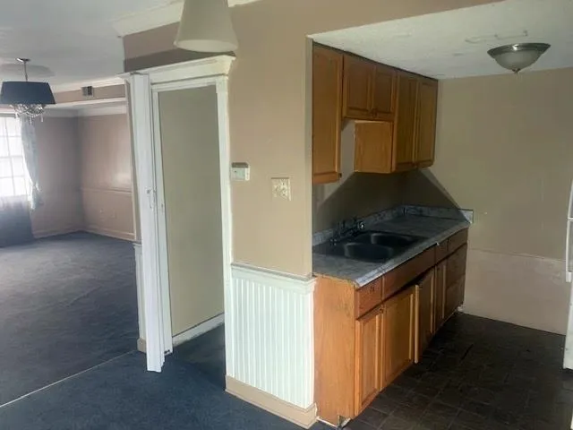 a kitchen with a stove and a refrigerator