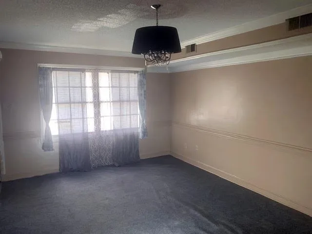 an empty room with a empty space and windows