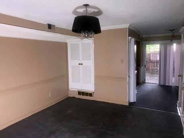 a kitchen with a refrigerator and a stove