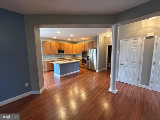 a view of kitchen with wooden floor