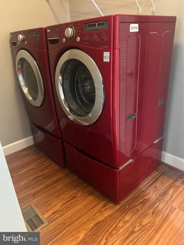 a view of a hallway with washer and dryer