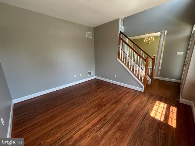 a view of an entryway with wooden floor