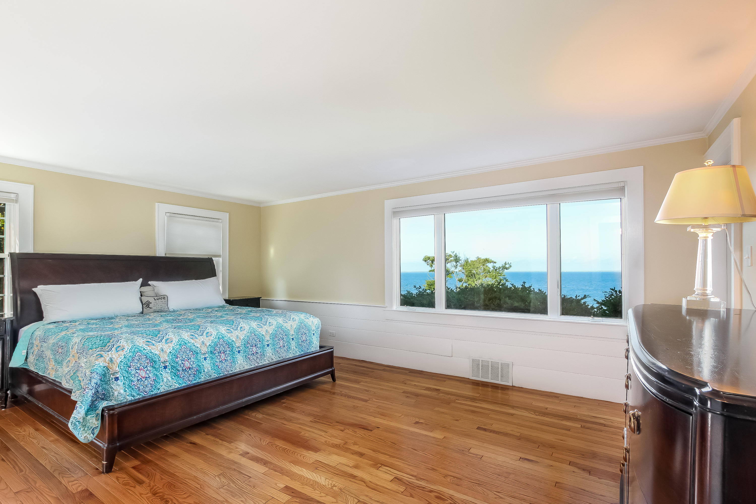 37 Beccles Road Falmouth, MA 02540 - Photo 13 of 32 a bedroom with a bed table and a large window