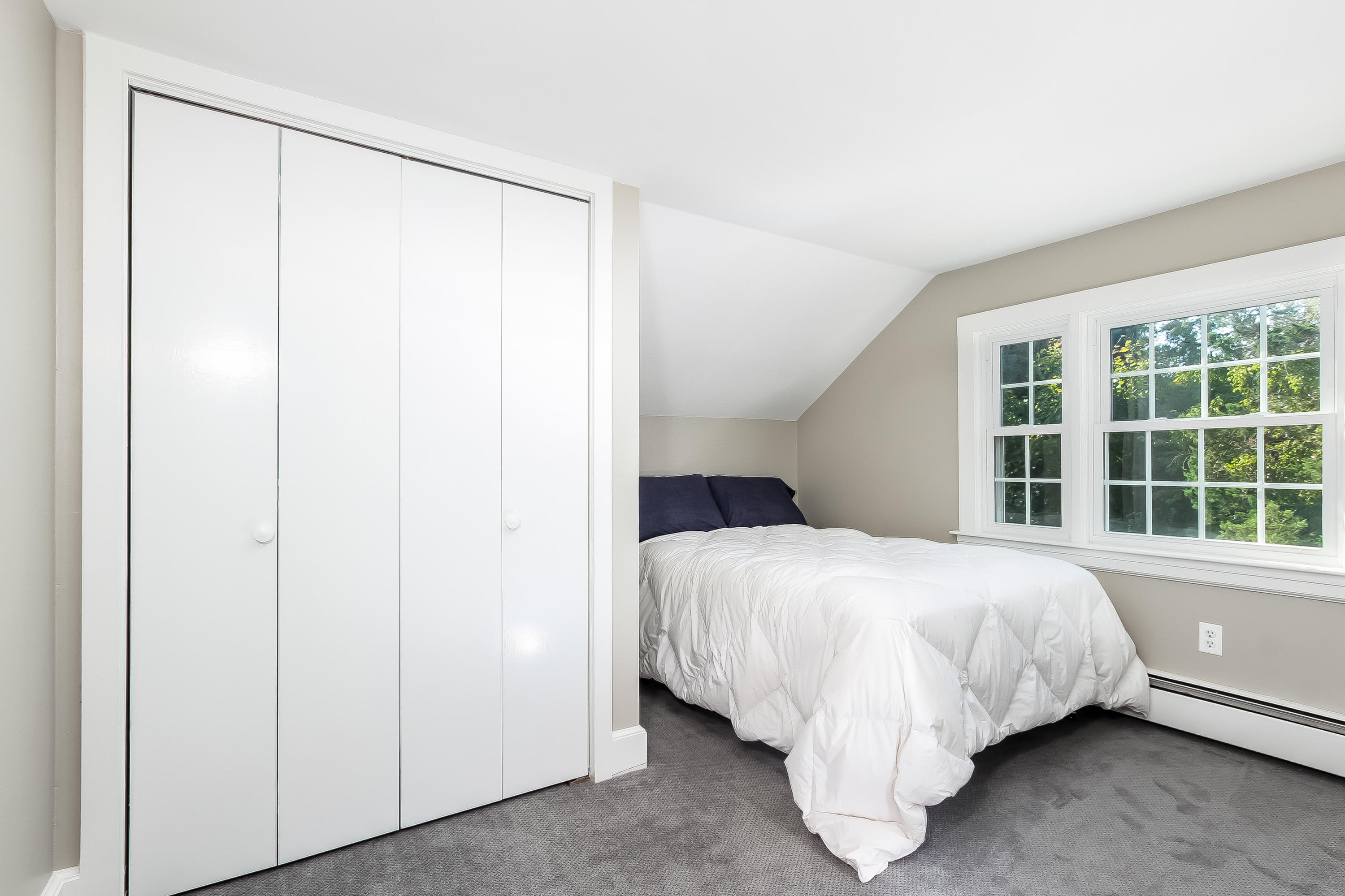 37 Beccles Road Falmouth, MA 02540 - Photo 17 of 32 a bed sitting in a bedroom next to a window