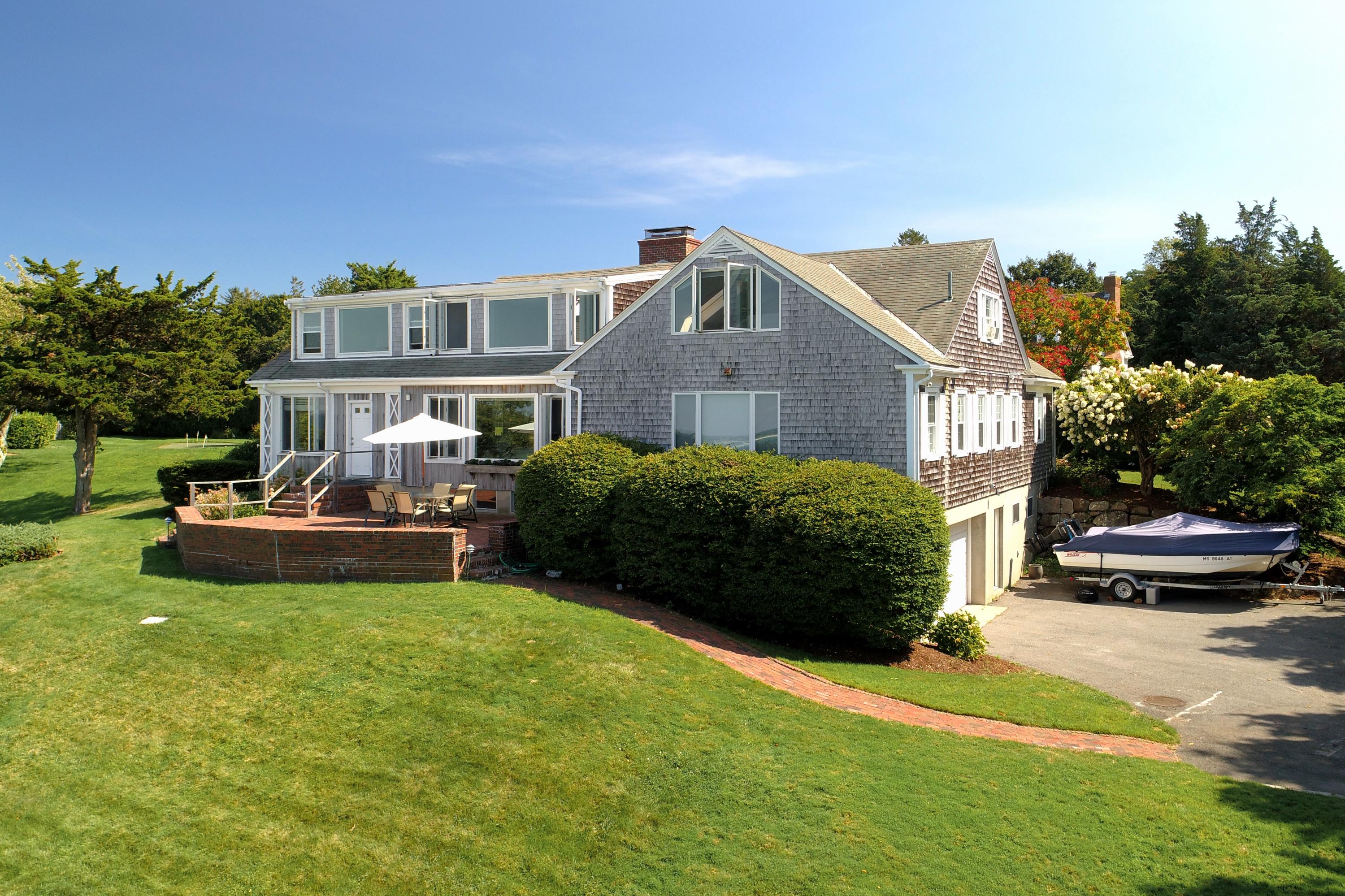 37 Beccles Road Falmouth, MA 02540 - Photo 20 of 32 a front view of a house with a garden and lake view