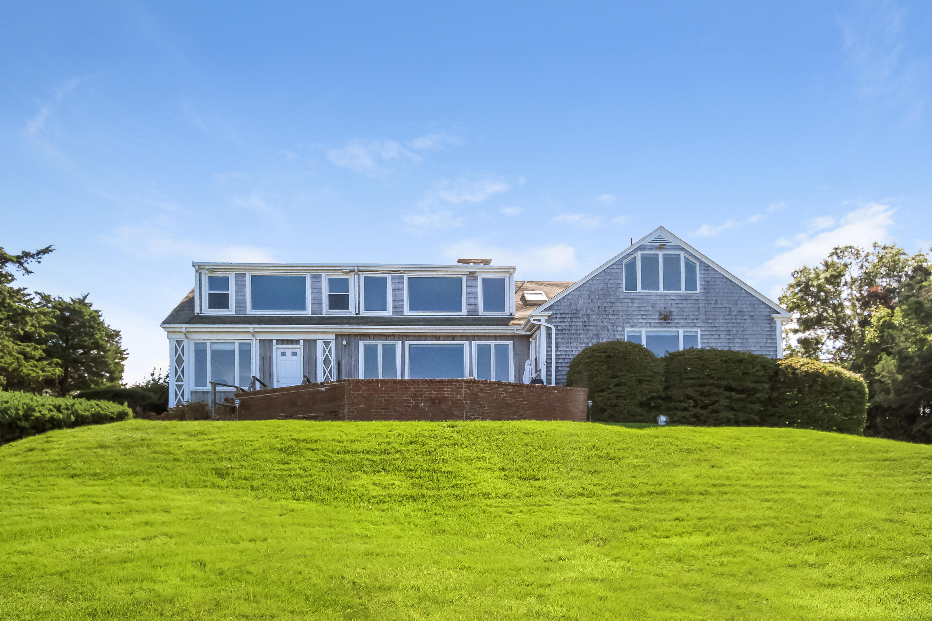 37 Beccles Road Falmouth, MA 02540 - Photo 21 of 32 a front view of a house with garden and trees