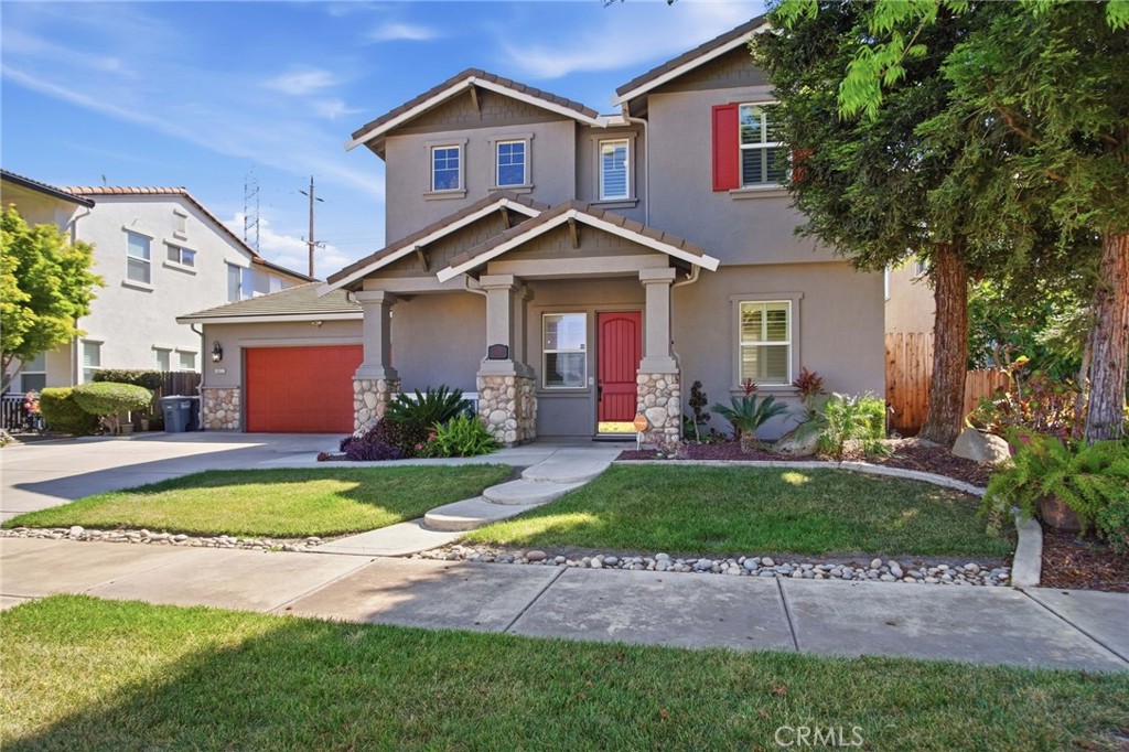 a view of a house with swimming pool and a yard