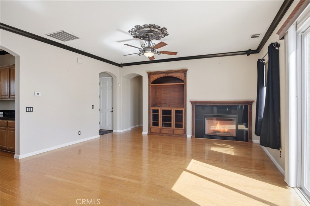 4822 Durant Way Merced, CA 95348 - Photo 15 of 48 a view of empty room with a fireplace and fan