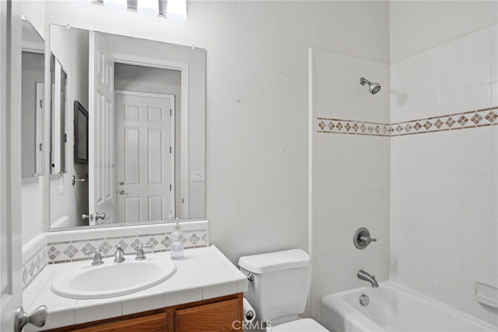 4822 Durant Way Merced, CA 95348 - Photo 19 of 48 a bathroom with a sink a toilet and shower