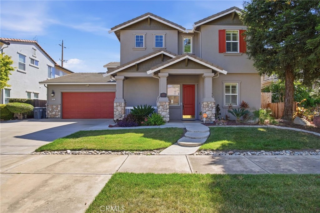 4822 Durant Way Merced, CA 95348 - Photo 2 of 48 a front view of a house with a yard and garage