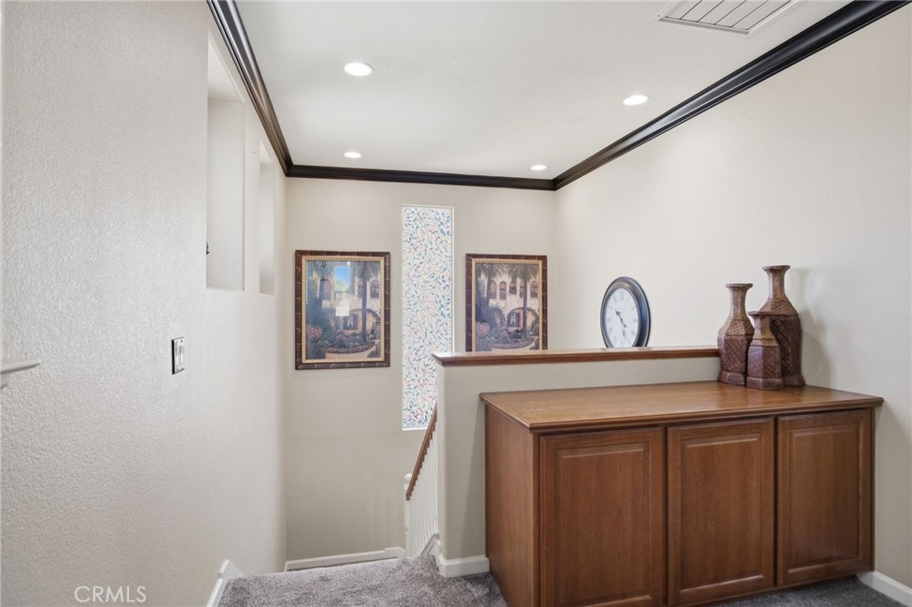 4822 Durant Way Merced, CA 95348 - Photo 21 of 48 a view of a hallway with paintings on the wall