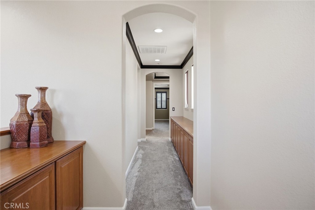 4822 Durant Way Merced, CA 95348 - Photo 22 of 48 a view of a hallway with wooden floor and staircase