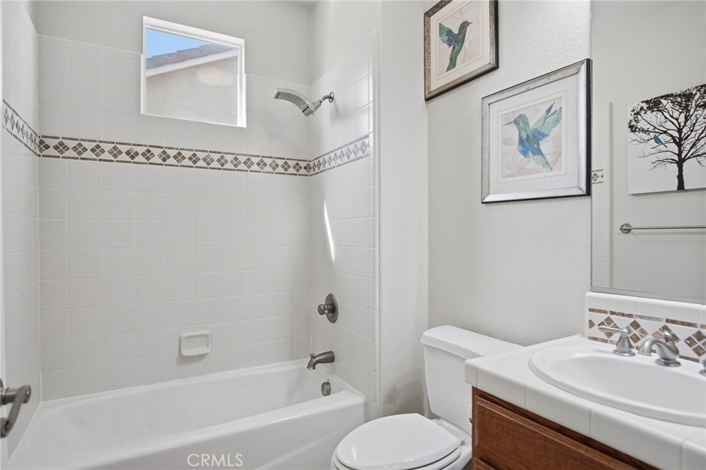 4822 Durant Way Merced, CA 95348 - Photo 26 of 48 a bathroom with a sink mirror toilet and bathtub