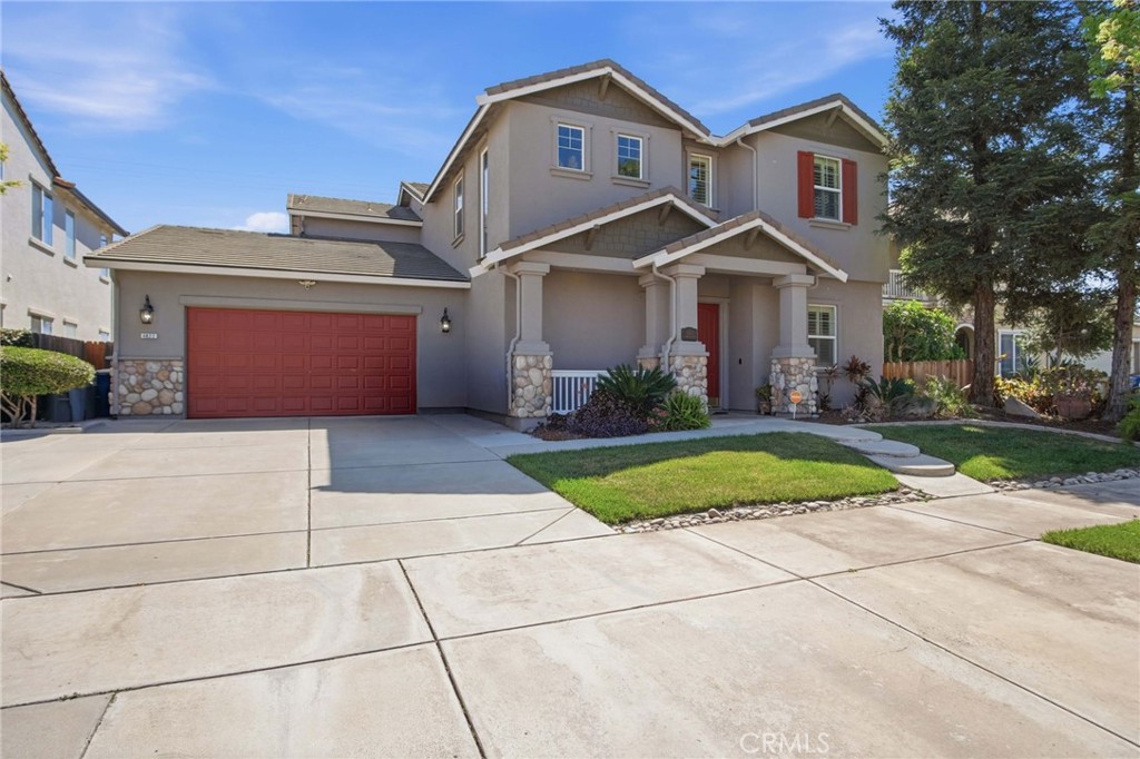 4822 Durant Way Merced, CA 95348 - Photo 3 of 48 a front view of a house with a yard and garage