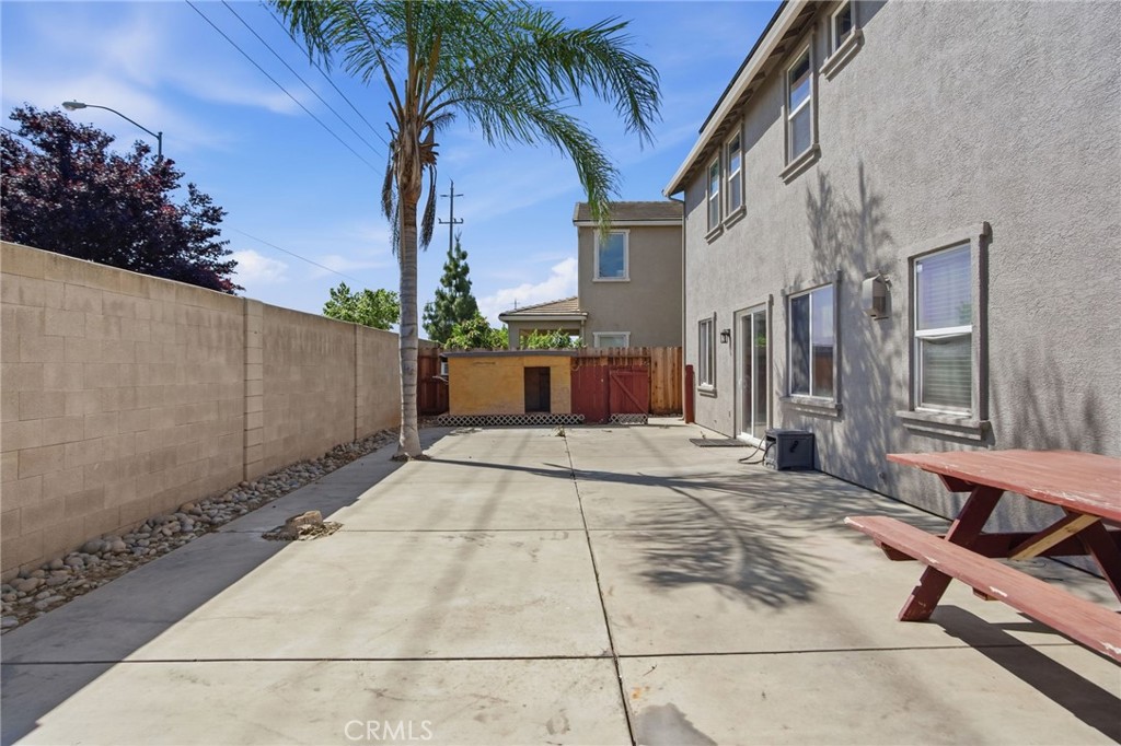 4822 Durant Way Merced, CA 95348 - Photo 37 of 48 a view of a building with a patio
