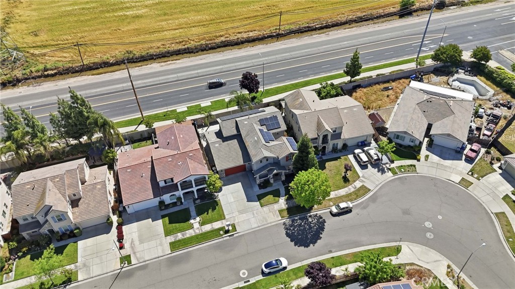 4822 Durant Way Merced, CA 95348 - Photo 41 of 48 an aerial view of a house with a garden and lake view