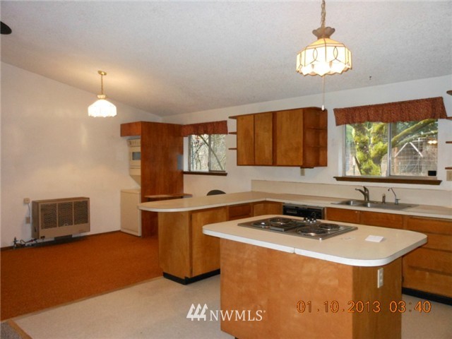 5740 133rd Avenue Southwest Rochester, WA 98579 - Photo 6 of 10 a room with a sink cabinets and window