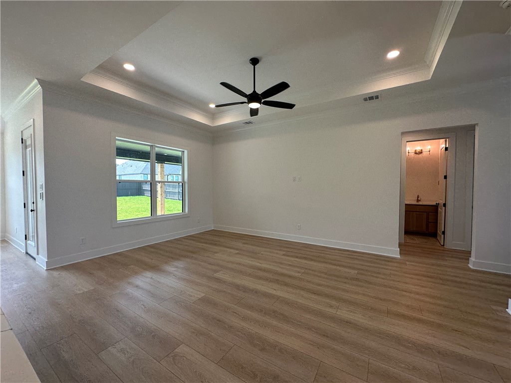 4302 Conestogo Court Bryan, TX 77802 - Photo 25 of 34 a view of an empty room with a window and a kitchen