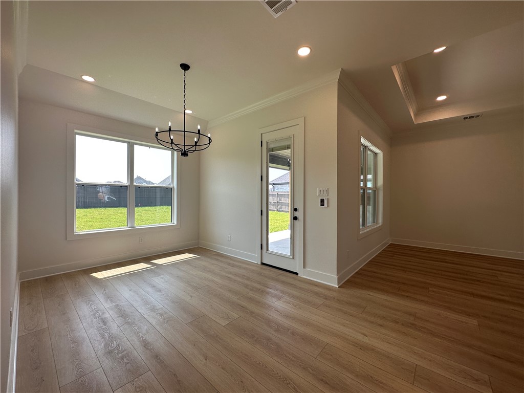 4302 Conestogo Court Bryan, TX 77802 - Photo 26 of 34 a view of an empty room with window and wooden floor
