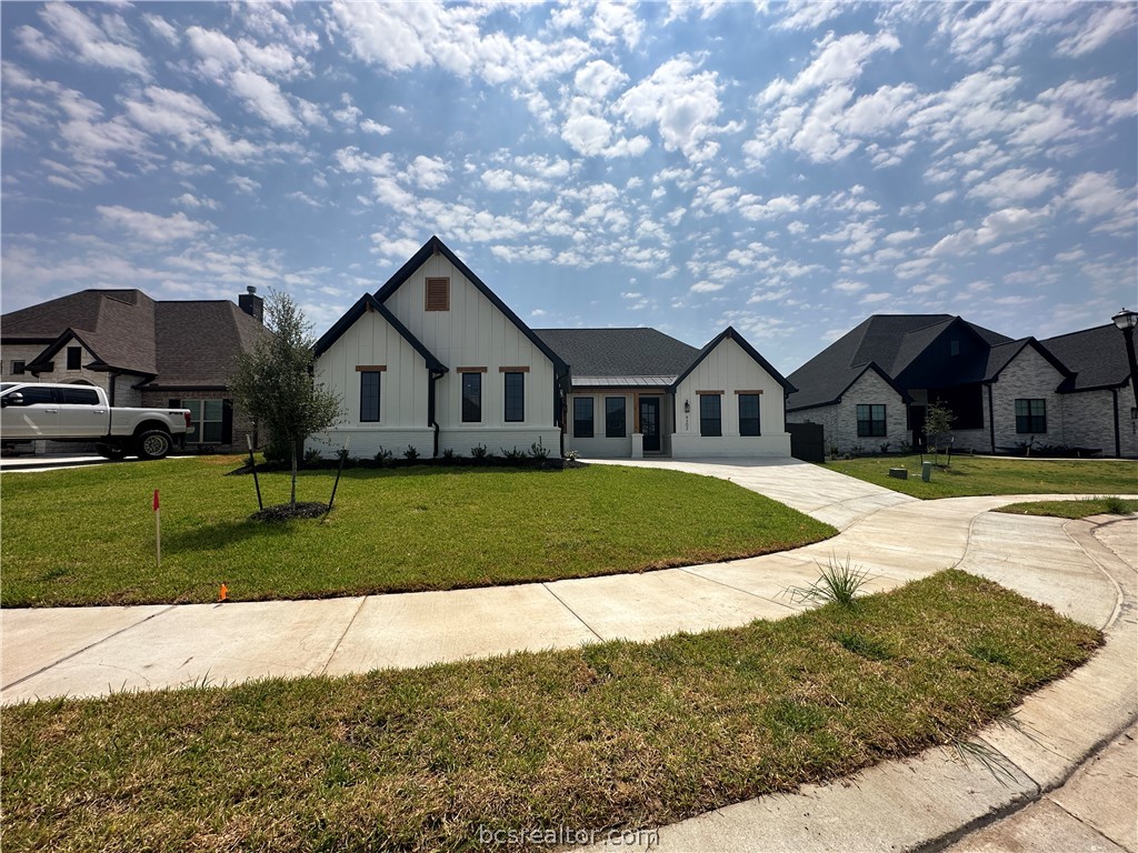 4302 Conestogo Court Bryan, TX 77802 - Photo 3 of 34 a front view of a house with a yard