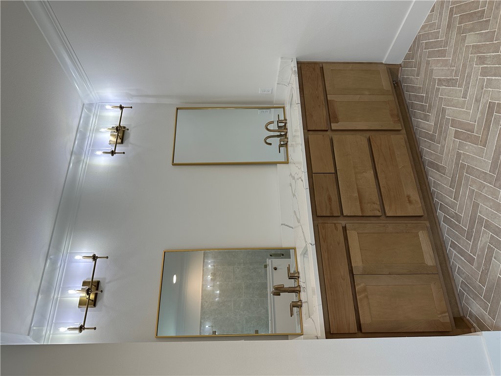 4302 Conestogo Court Bryan, TX 77802 - Photo 7 of 34 a bathroom with a sink double vanity and a mirror