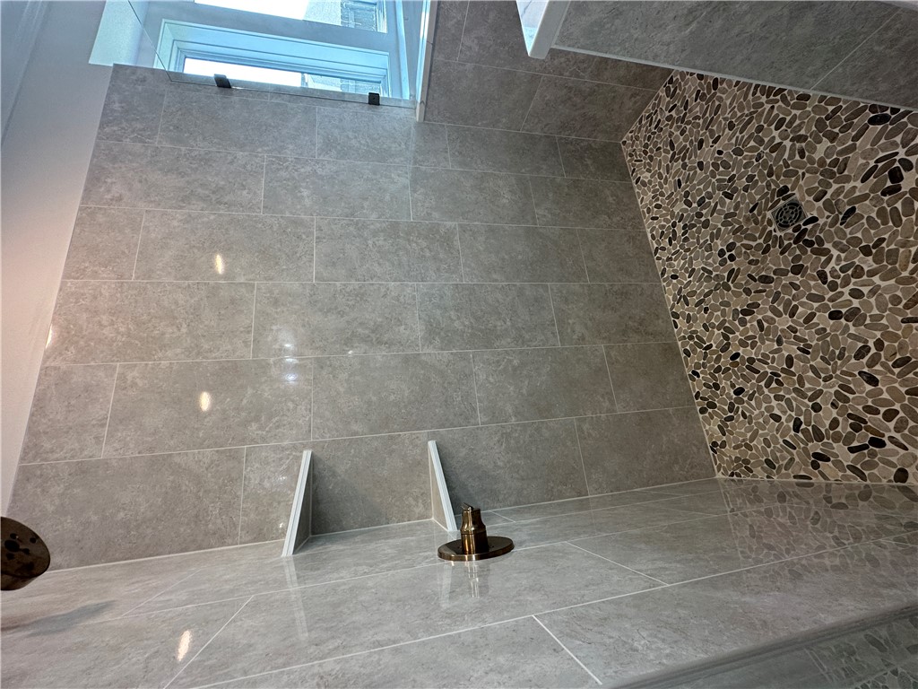4302 Conestogo Court Bryan, TX 77802 - Photo 9 of 34 a bathroom with a shower