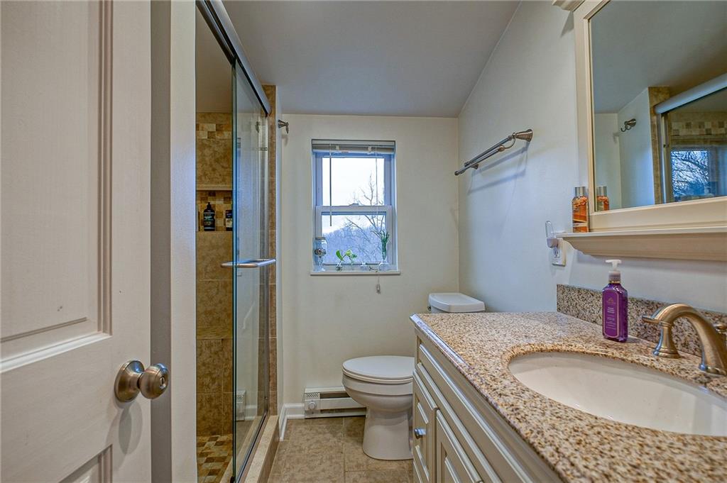 1318 Oakridge Road McDonald, PA 15057 - Photo 17 of 25 a bathroom with a granite countertop sink toilet and shower