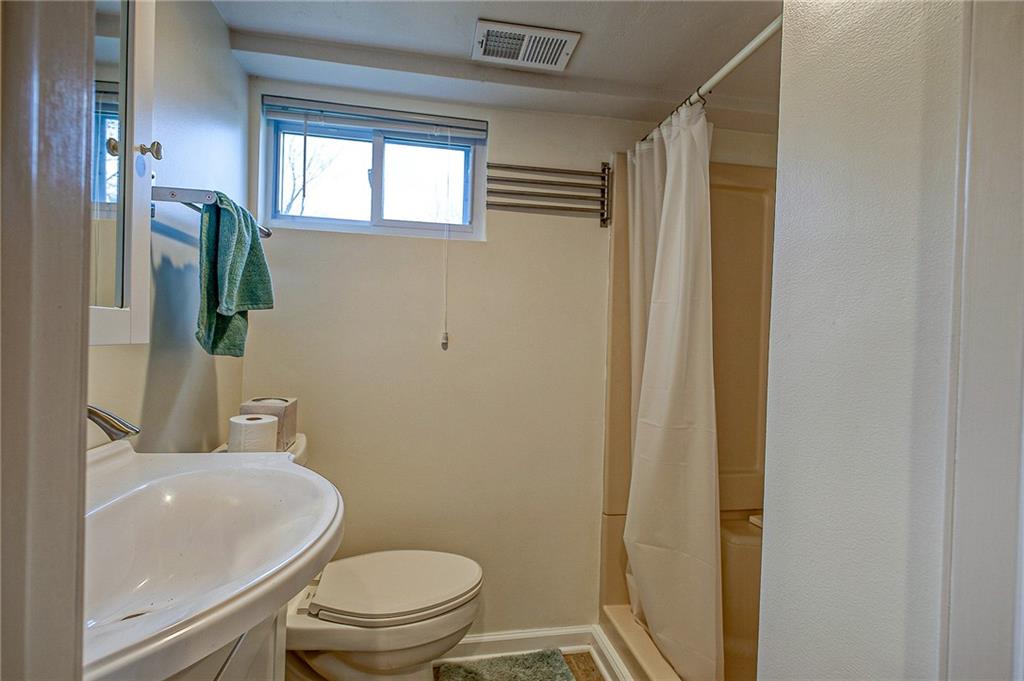 1318 Oakridge Road McDonald, PA 15057 - Photo 22 of 25 a white toilet sitting next to a bathroom sink
