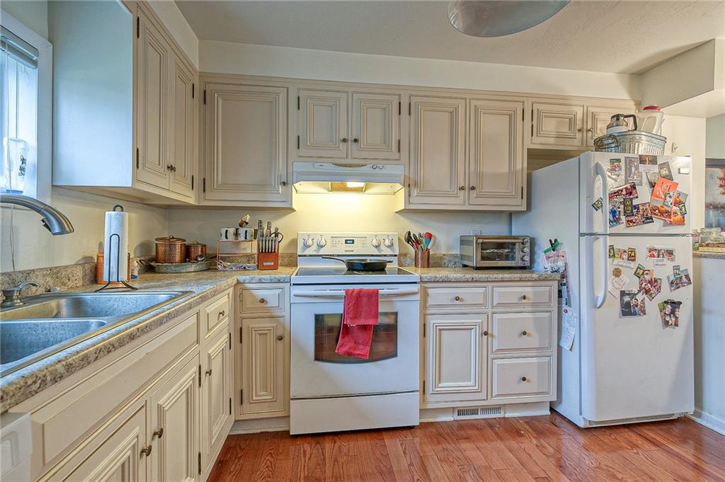 1318 Oakridge Road McDonald, PA 15057 - Photo 4 of 25 a kitchen with stainless steel appliances granite countertop a refrigerator and cabinets