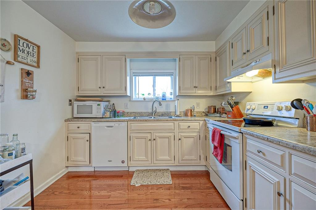 1318 Oakridge Road McDonald, PA 15057 - Photo 5 of 25 a kitchen with granite countertop a sink cabinets stainless steel appliances and a window