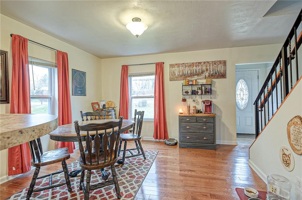 1318 Oakridge Road McDonald, PA 15057 - Photo 8 of 25 a view of a dining room with furniture window and wooden floor